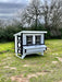 OverEZ Chicken Coop Large Up to 15 Chickens white chicken coop front on grass